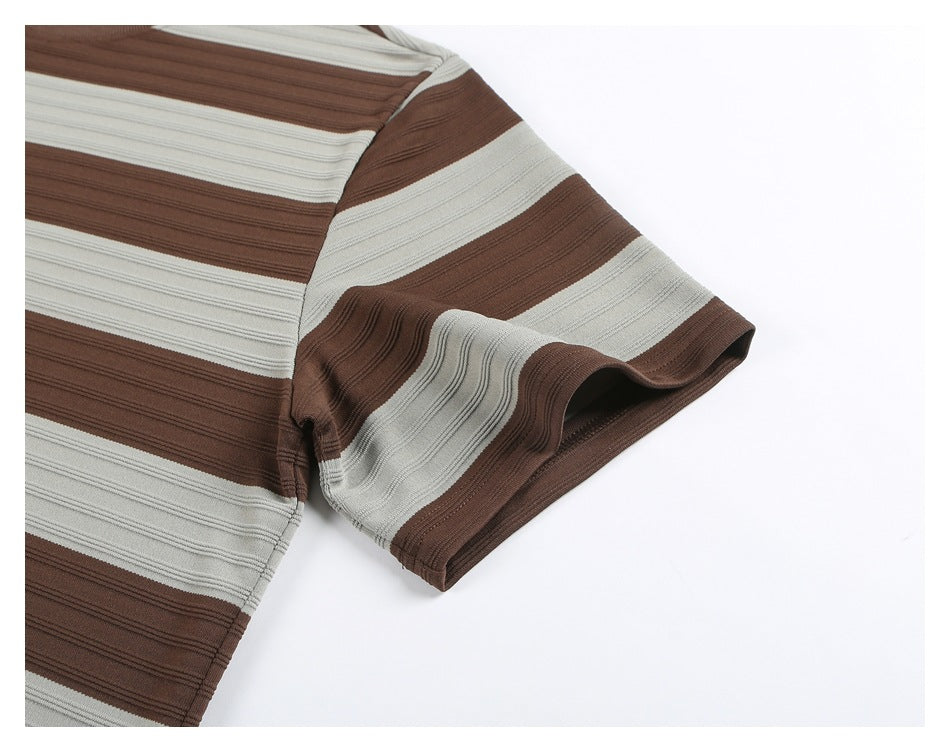 Close-up of the striped shirt’s short sleeve and sleeve opening against a white background.