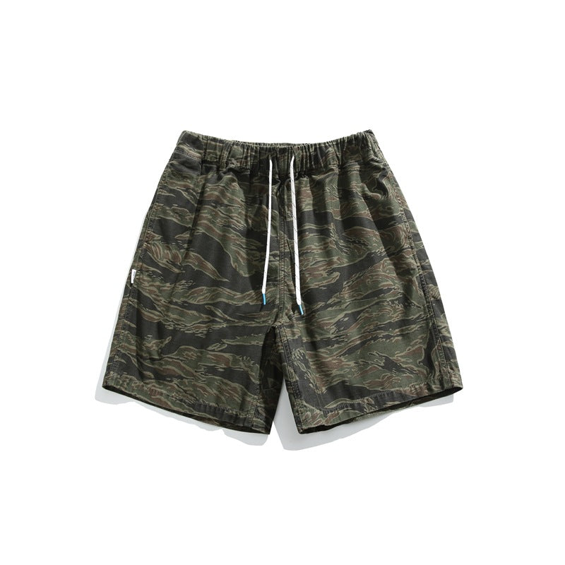 Tiger stripe camo army green shorts with elastic drawstring waist, flat lay front view