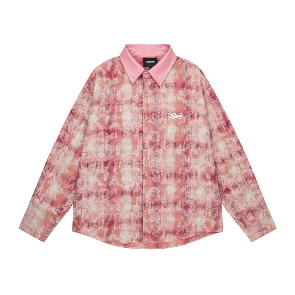Front view of a pink and cream abstract-print button-up shirt with a pink pointed collar and chest embroidery.