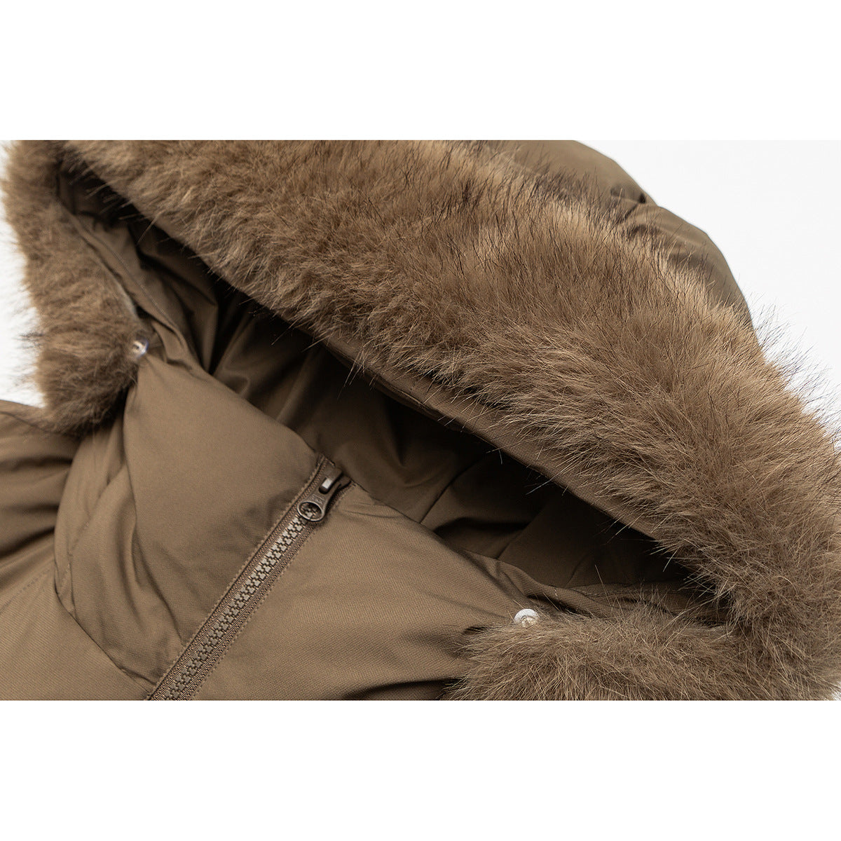 Close-up of a brown padded jacket hood with a thick brown fur trim and front zipper.