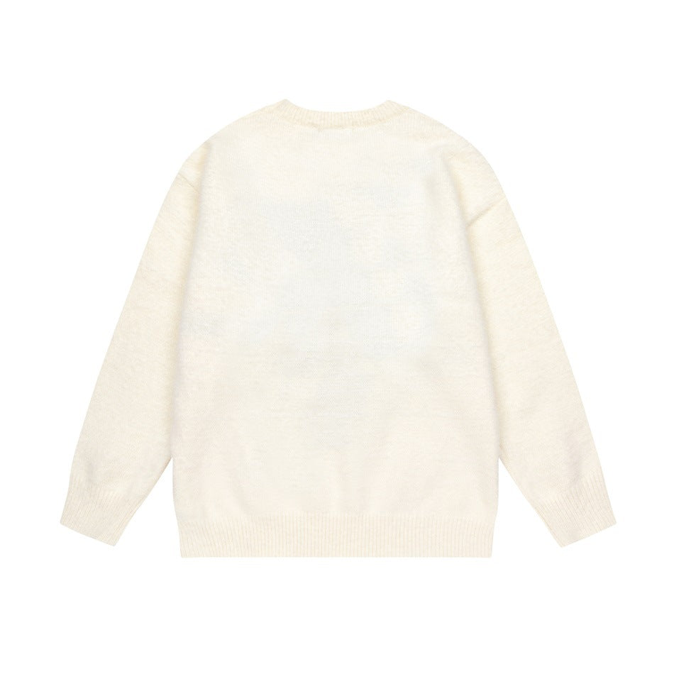 Back view of an ivory crew-neck sweater with long sleeves and ribbed cuffs and hem, laid flat on white.