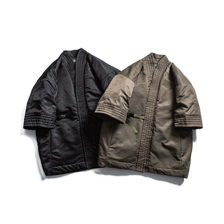 Two short-sleeved quilted jackets shown from the front in black and olive.