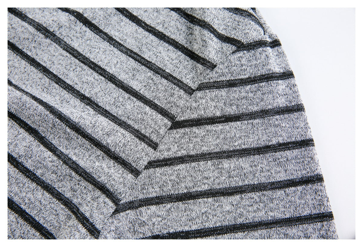 Close-up of the gray-and-black striped knit at a garment seam.