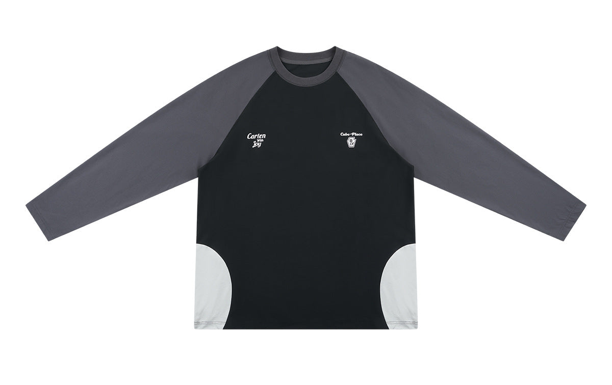 Flat-lay front of a black color-block long-sleeve shirt with charcoal sleeves, white side panels, and small chest prints.