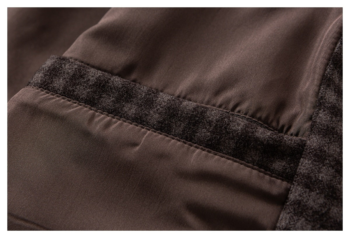 Close-up of dark brown smooth panels joined by a charcoal fuzzy fabric seam.