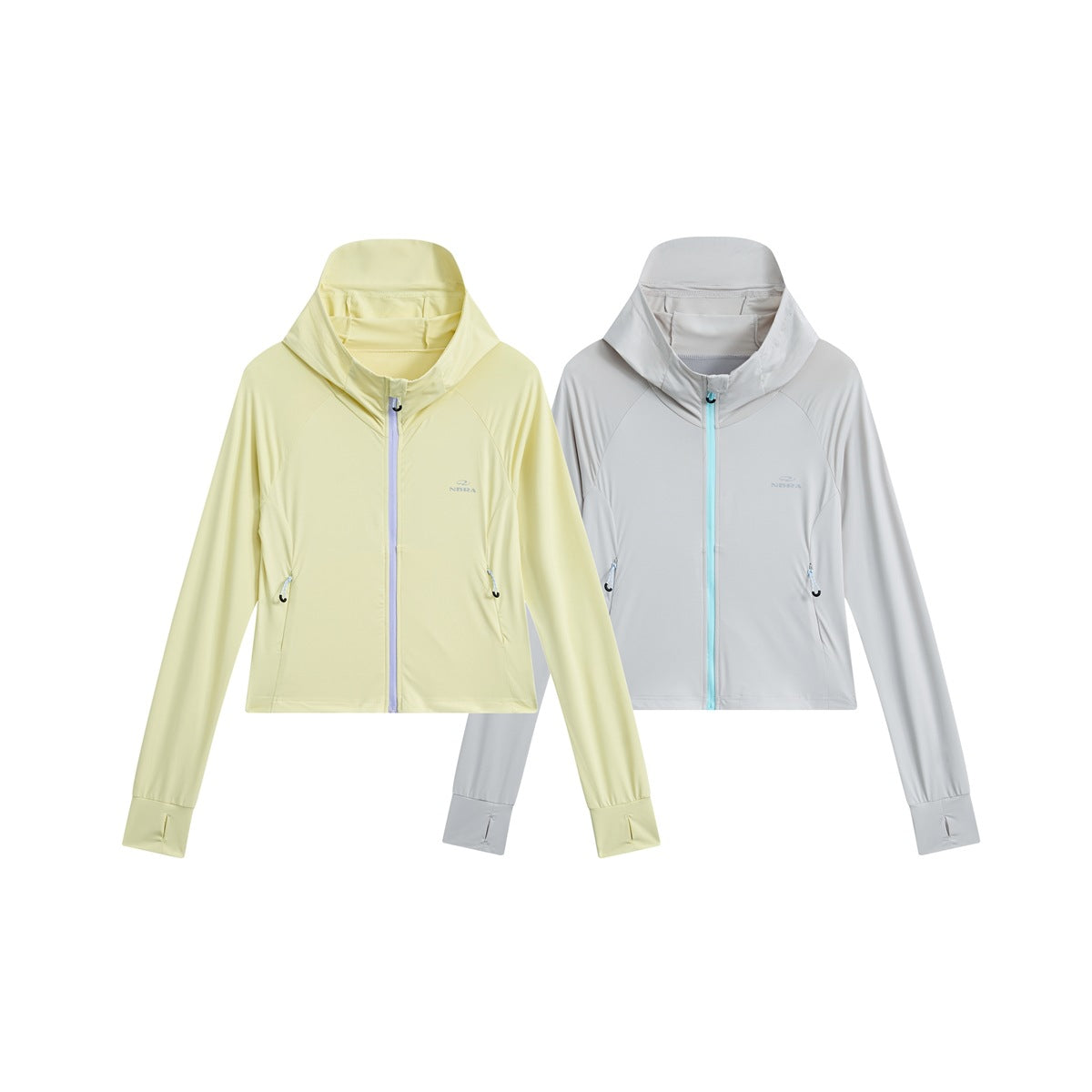 Two hooded jackets shown from the front: pale yellow and light gray, both with contrasting zippers and side pockets.