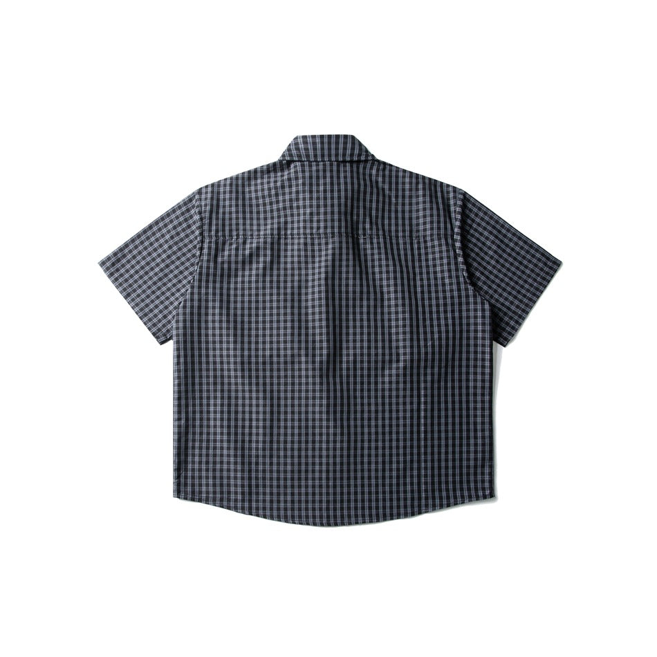 Back view of ink blue small-check short-sleeve shirt with upper back yoke seam, flat lay