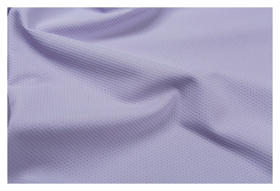 Close-up of pale lavender fabric showing a fine, evenly spaced perforated mesh texture.