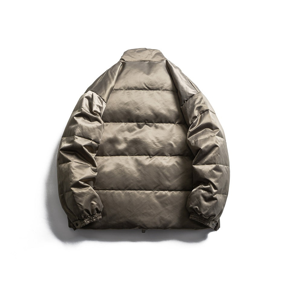 Back view of a taupe-gray padded jacket with horizontal quilting and gathered cuffs, laid flat.
