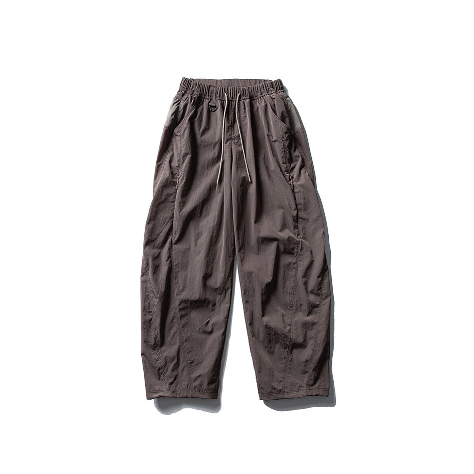 Muted mauve-brown wide-leg drawstring pants with elastic waistband, flat lay front view
