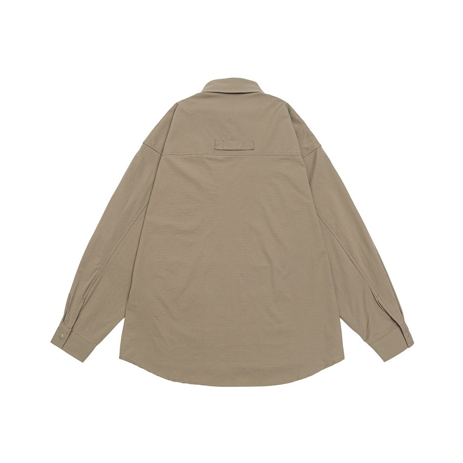 Back view of a taupe long-sleeve overshirt laid flat, with a collar, yoke seam, and button cuffs.