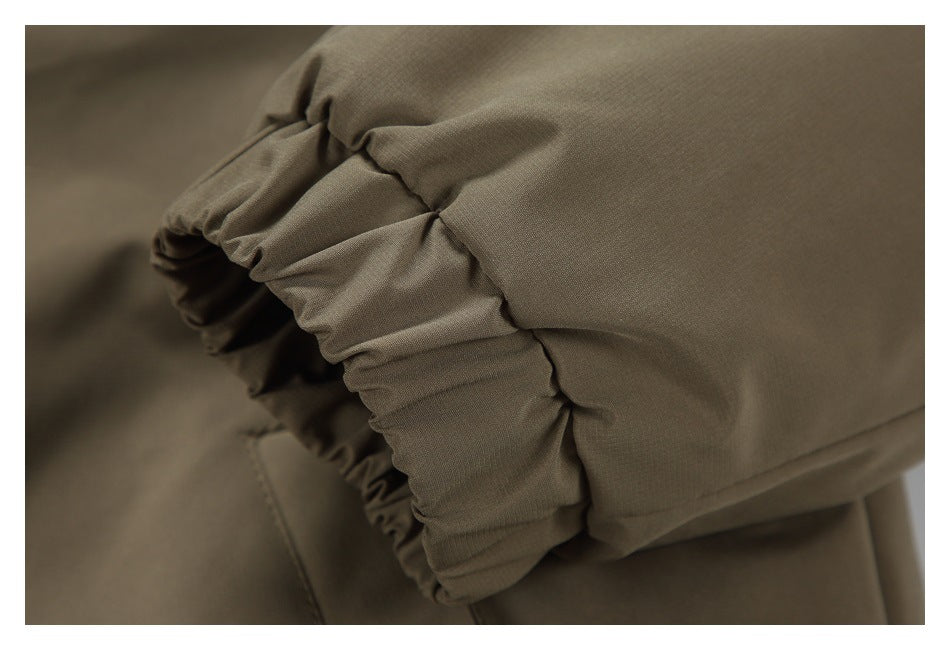 Close-up of gathered elastic edging on an olive-brown garment.