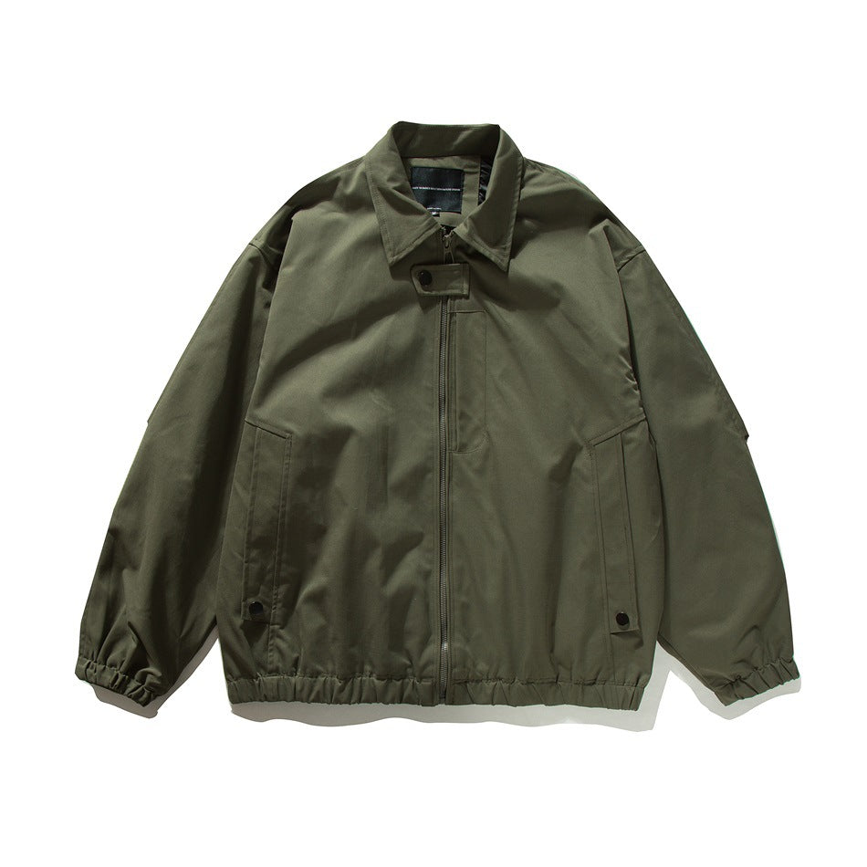 Army green zip-front bomber-style jacket flat lay with pointed collar, slanted pockets, snap tabs and elastic hem