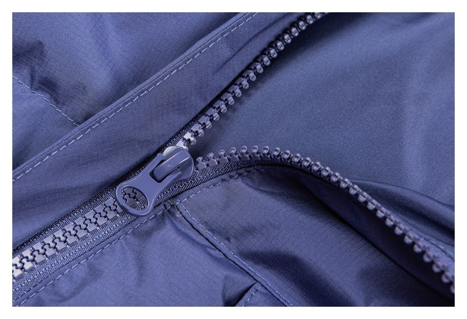 Close-up of a chunky periwinkle zipper and pull on matching garment fabric.