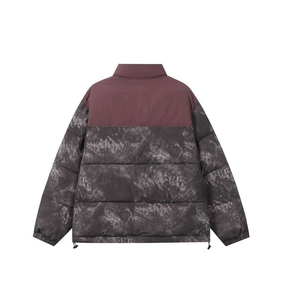 Back view of a plum and charcoal mottled puffer jacket with a high collar and adjustable hem.