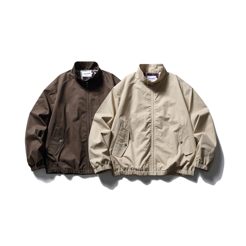 Two zip-front jackets shown together: one dark brown and one light beige, both with stand collars and flap pockets.
