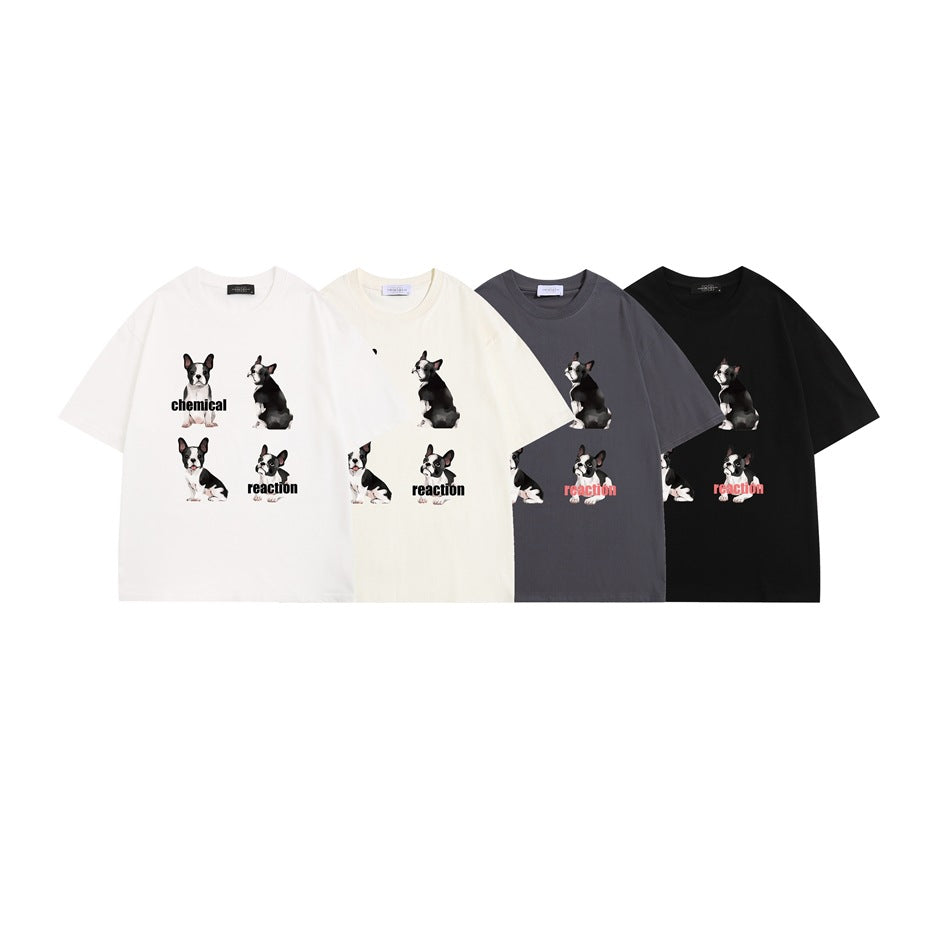 Four T-shirts in white, cream, charcoal gray, and black, each printed with dog illustrations and “chemical reaction.”