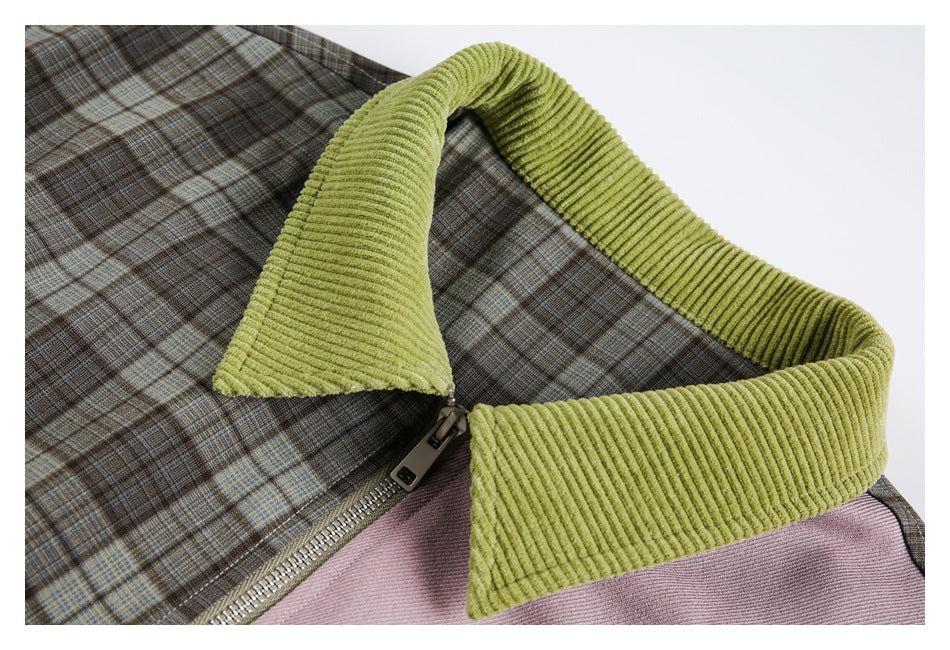 Close-up of a jacket's lime-green ribbed collar, brown plaid fabric, mauve panel, and metal zipper.