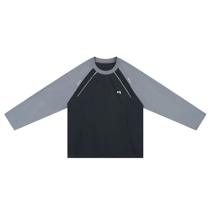 Deep black long-sleeve raglan tee with light gray sleeves and contrast seams, flat front view