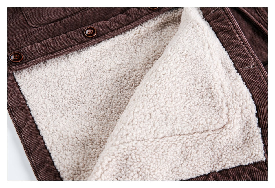 Inside view of a dark brown jacket with cream fleece lining, brown buttons, and a lined pocket.
