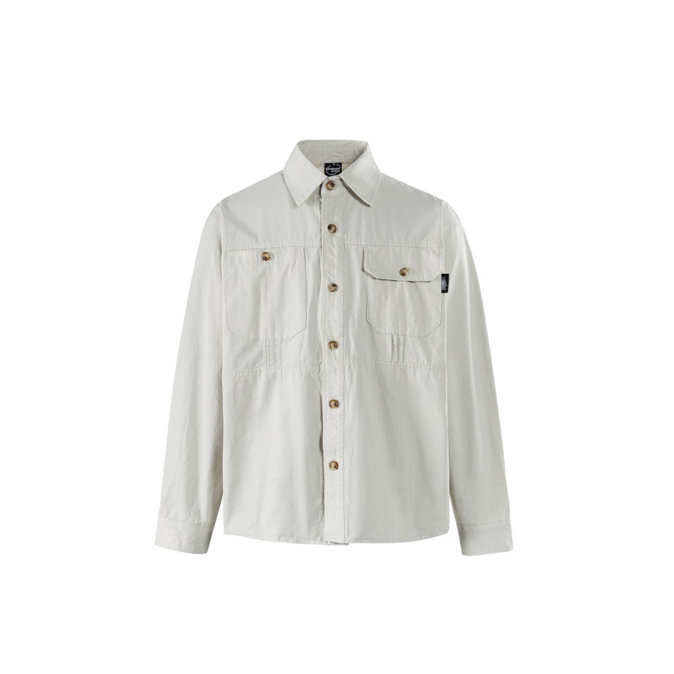 Light gray long-sleeve button-front shirt with chest pockets and tan buttons, front view on white background