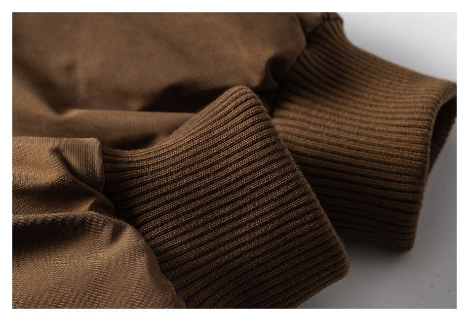 Close-up of brown jacket sleeves and thick ribbed cuffs.