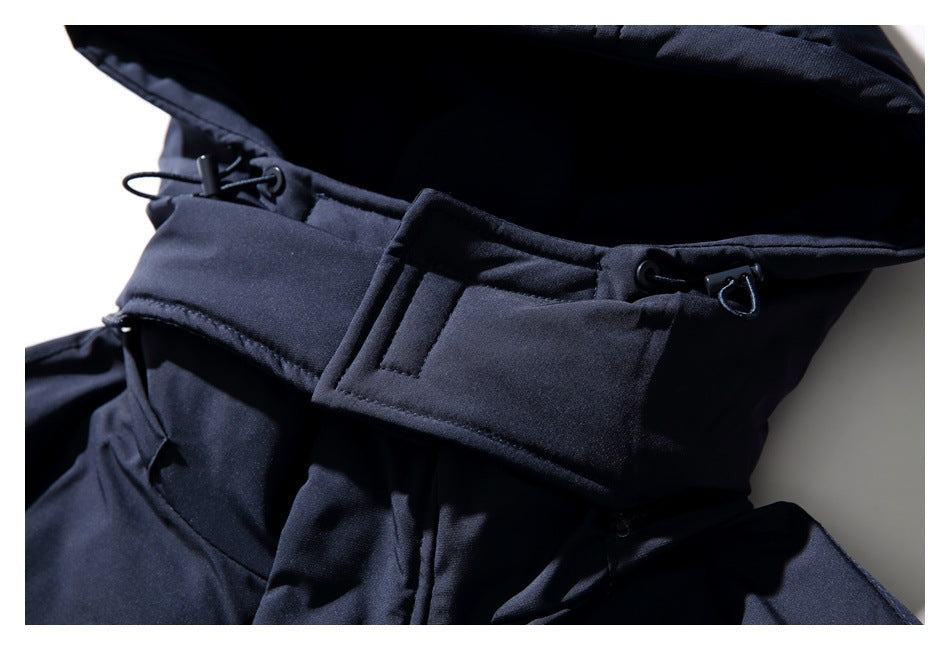 Close-up of the dark navy jacket hood and front fastening strap with adjustable cord hardware.