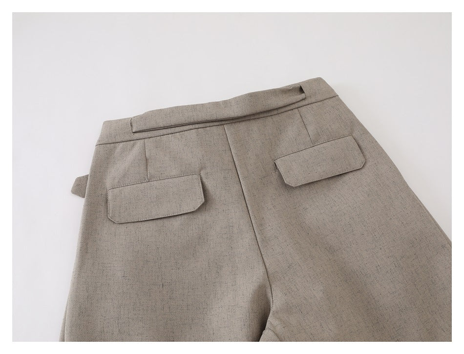 Back view of beige-gray trousers with a waistband and two flap pockets.