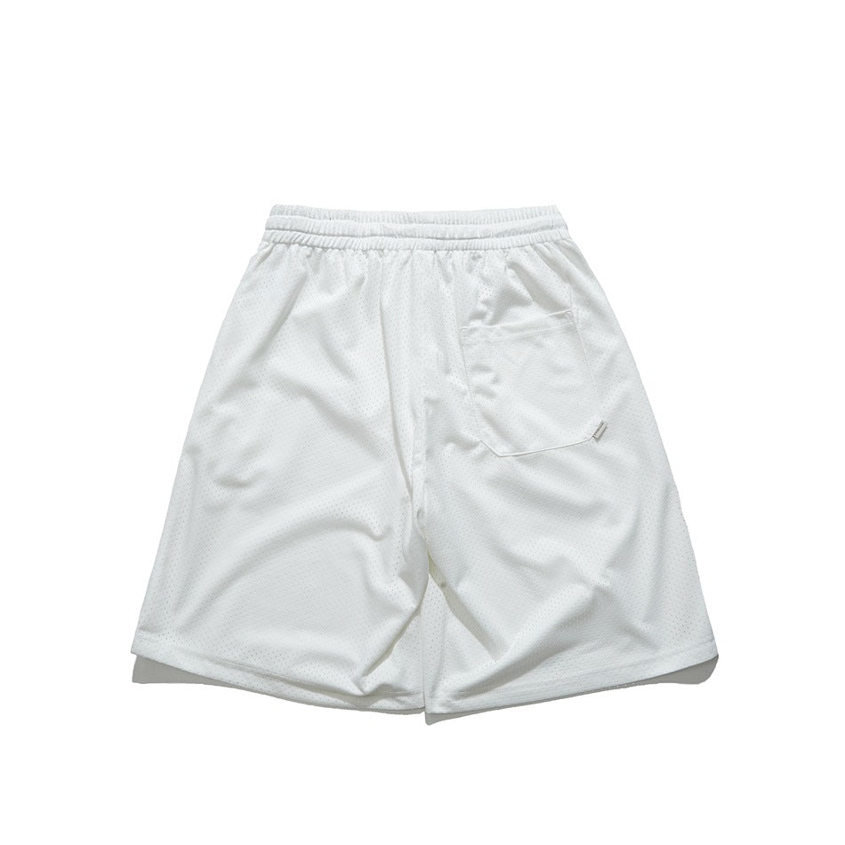Back view of white perforated mesh shorts with an elastic waistband and a rear pocket.
