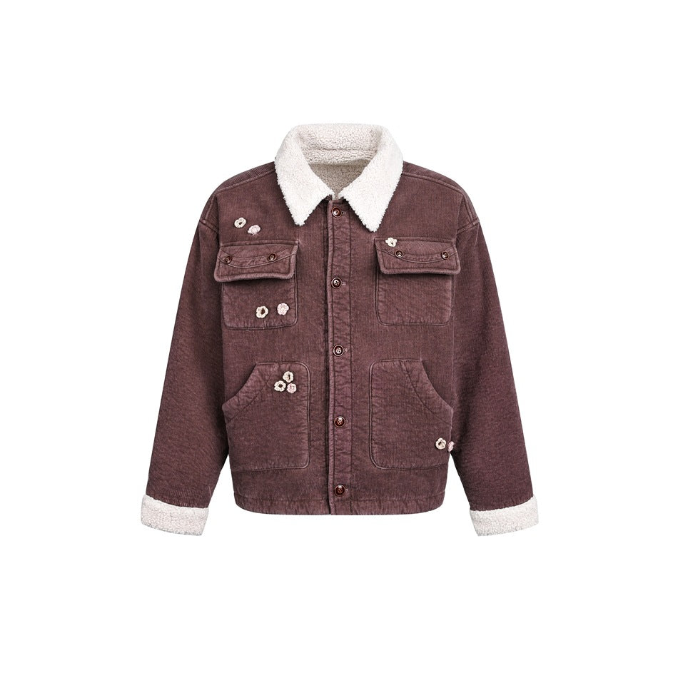 Brown corduroy-textured button-front jacket with off-white fleece-like collar and cuffs, four pockets and small flower