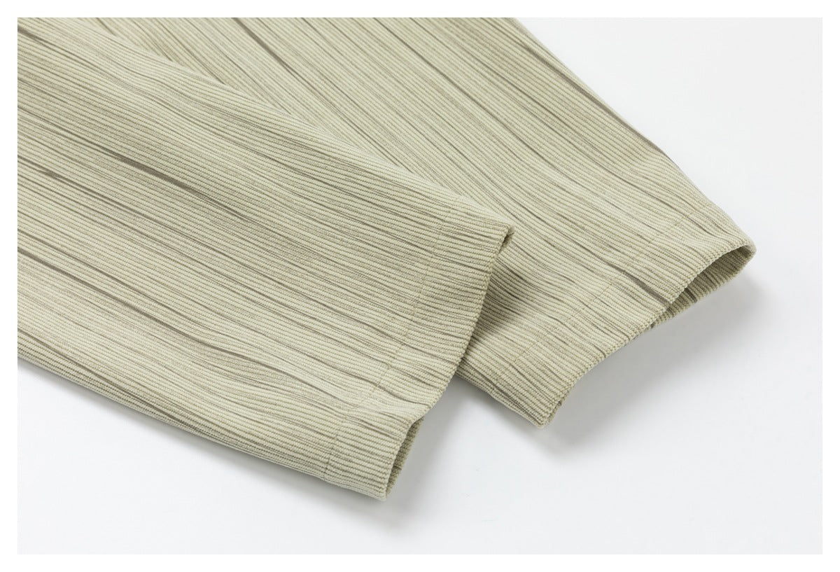 Close-up of a light beige garment sleeve cuff and seam.