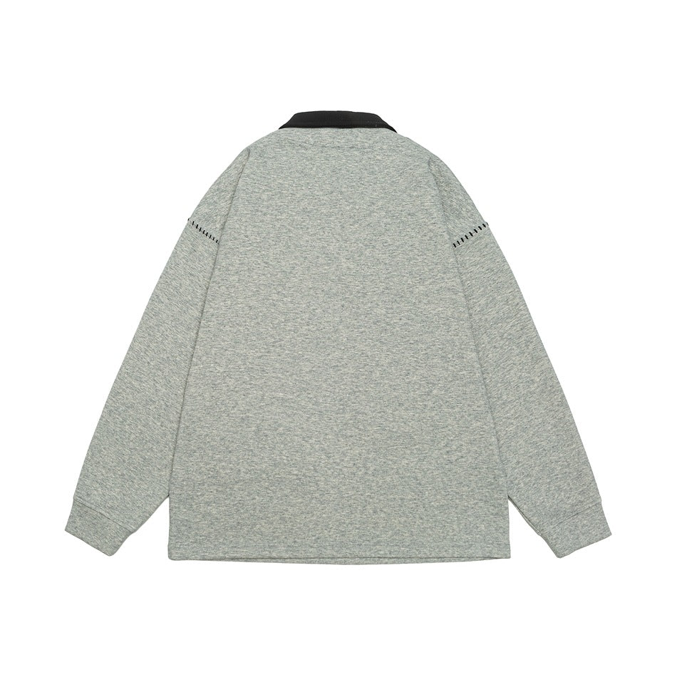 Back view of a heather-gray long-sleeve top with a black collar and short black stitch accents on the upper sleeves.