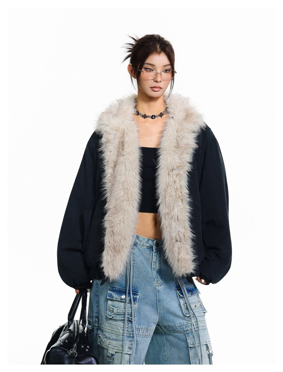 Front view of a model in an open black jacket with a voluminous light-beige fur collar and long front panels.