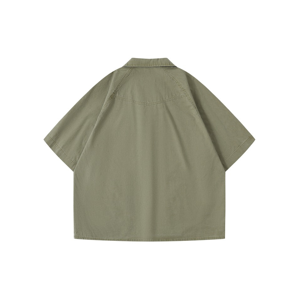 Back view of an olive-gray short-sleeve shirt with a yoke seam and wide sleeves.