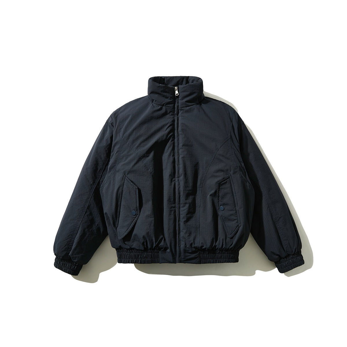 Navy stand-collar zip jacket flat lay with angled snap flap pockets and elastic cuffs and hem