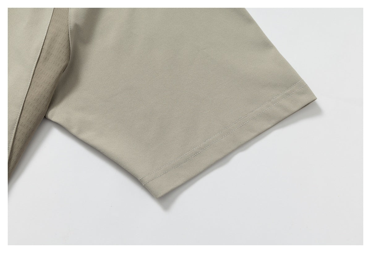 Close-up of the light taupe T-shirt's short sleeve and double-stitched hem.