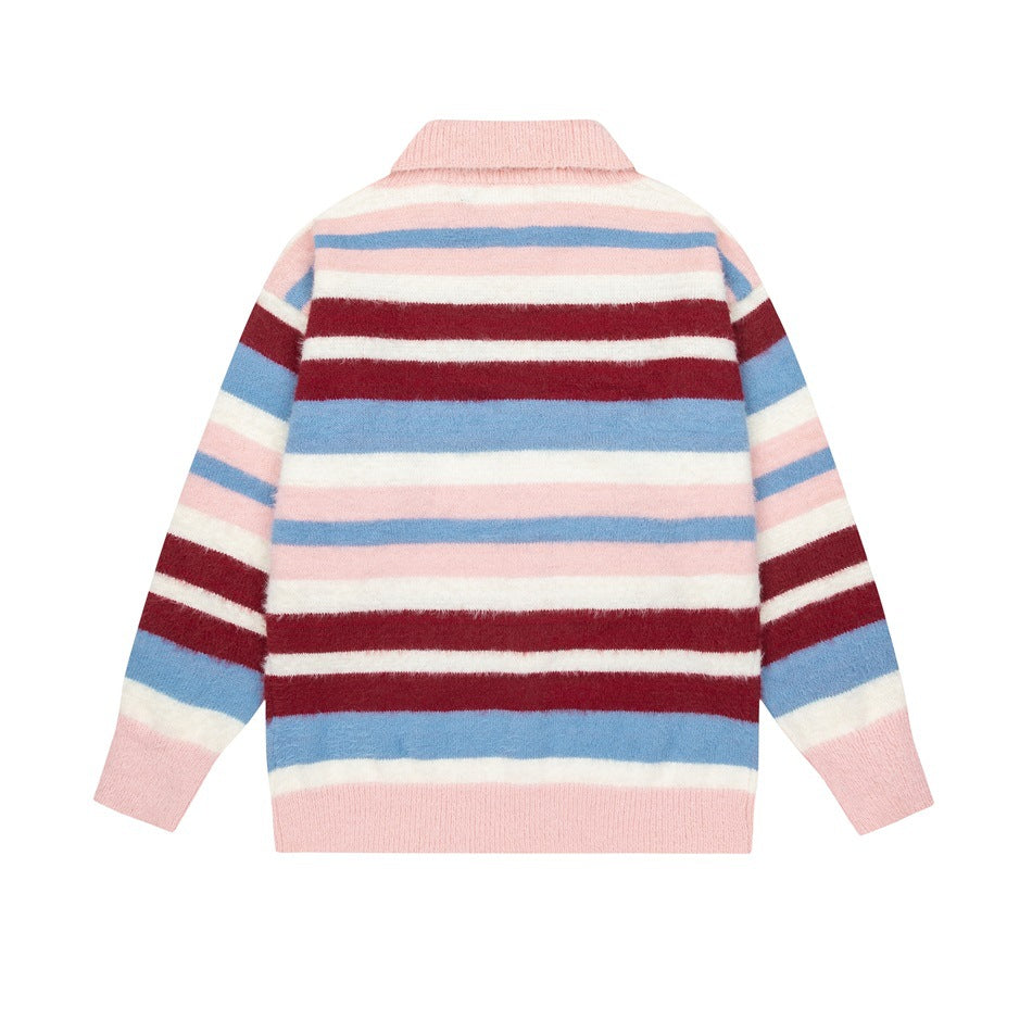 Back view of a pink cardigan with horizontal white, blue, and burgundy stripes on a white background.
