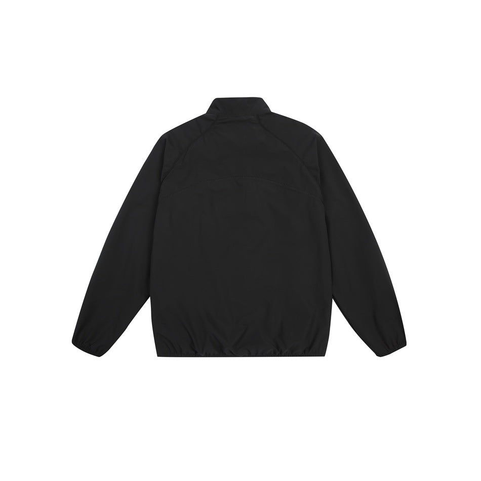Back view of a black long-sleeve jacket with a stand collar, curved shoulder seams and elastic cuffs and hem.