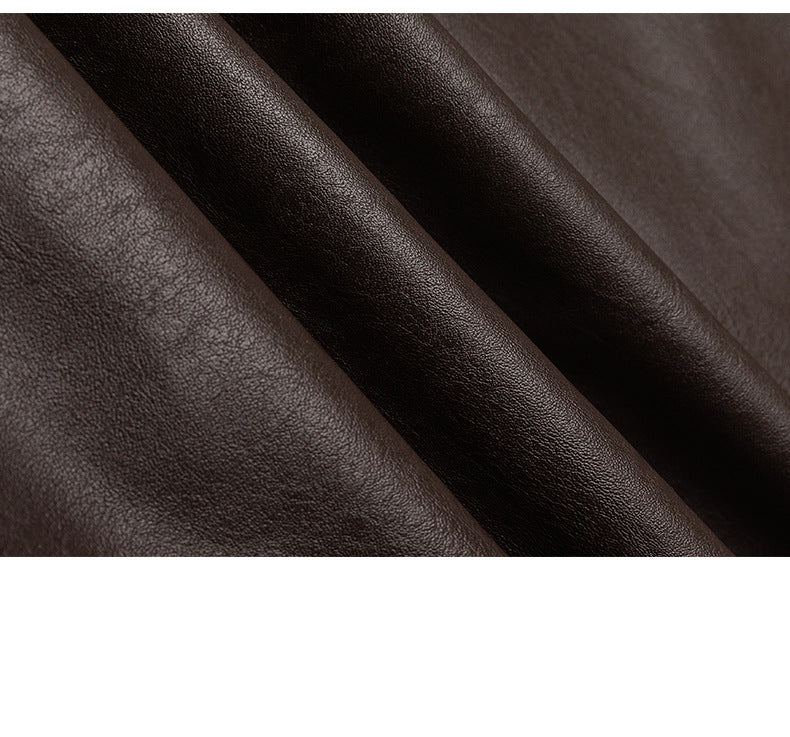 Close-up of the jacket's dark brown textured surface and folds.