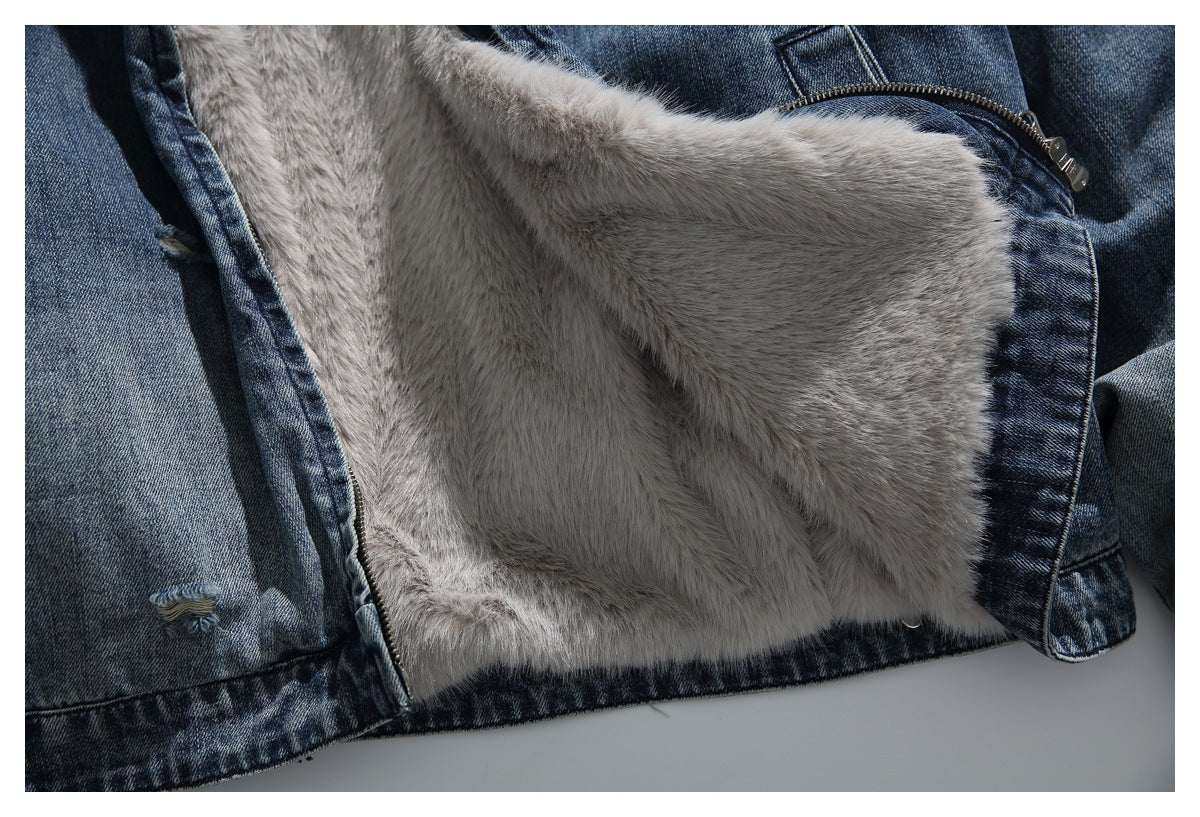The open blue denim jacket reveals its light gray plush lining and front zipper.