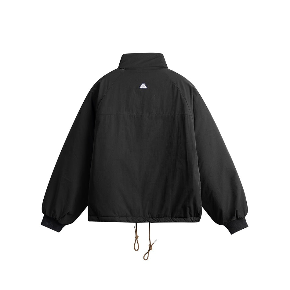 Black padded jacket, back flat view with raglan sleeves, upper back seam, small triangular patch and drawcord hem