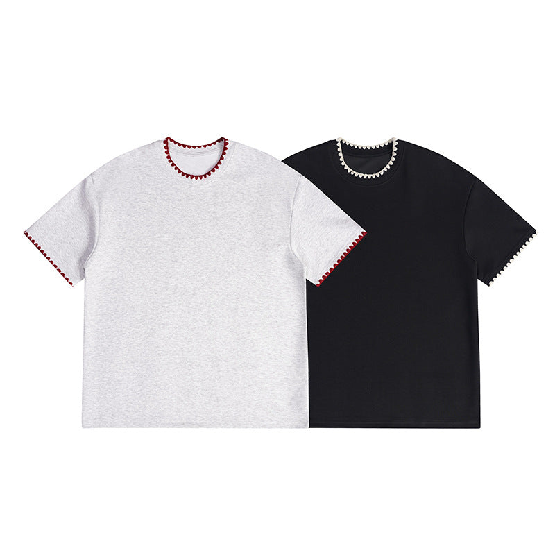 Front view of light gray and black short-sleeve T-shirts with contrasting scalloped trim.