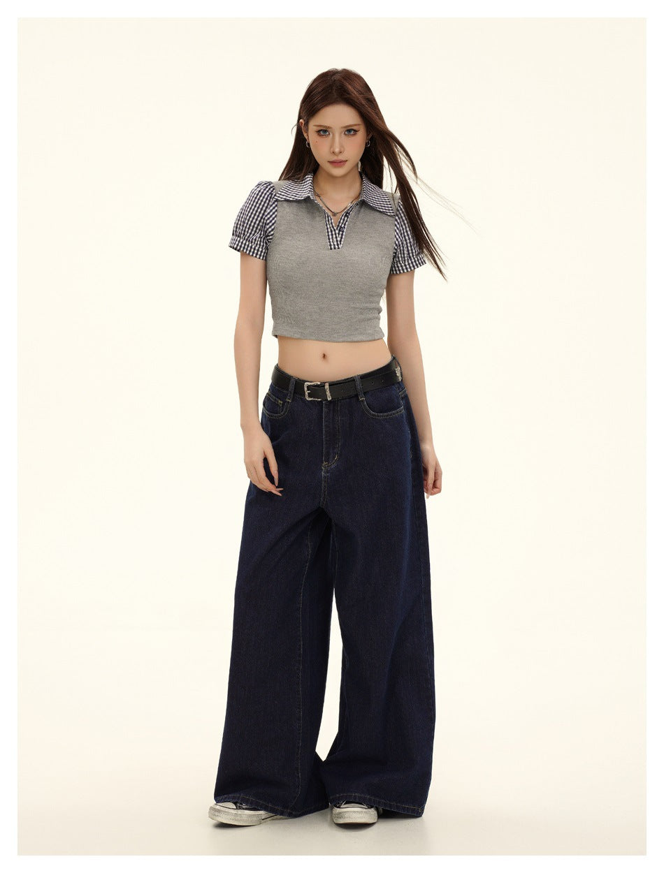 Model in gray cropped top with gingham collar and puff sleeves, styled with wide-leg dark denim and belt
