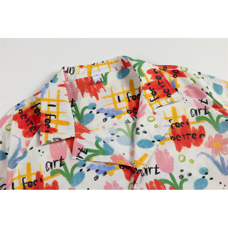 Close-up of a white shirt collar and lapels with colorful abstract artwork and black English lettering.