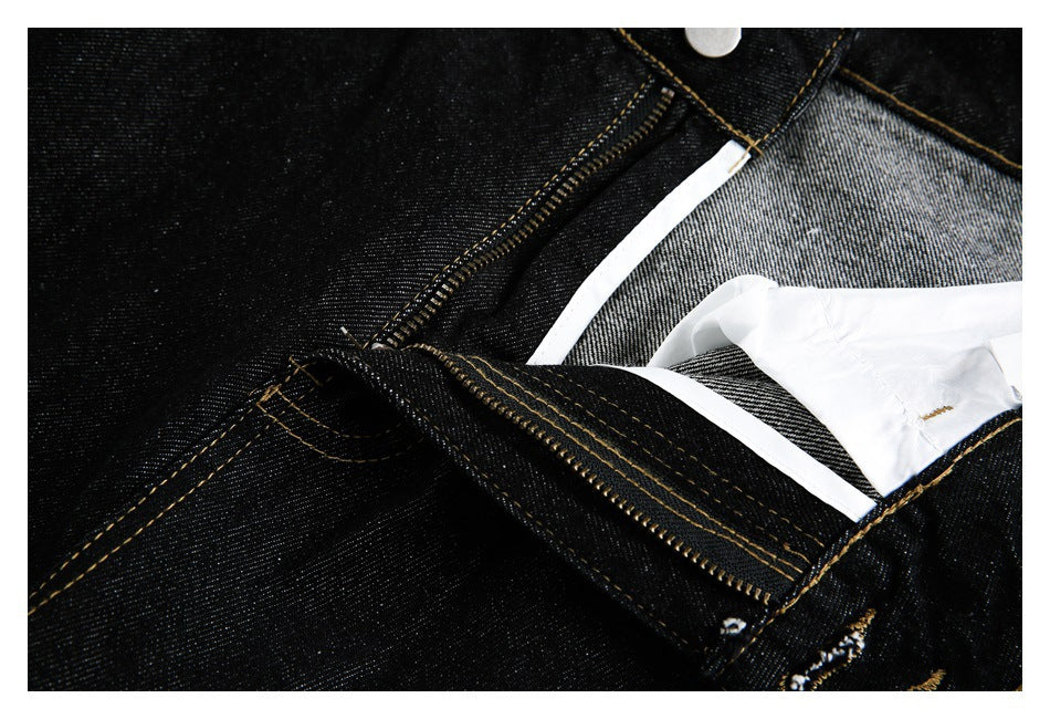 Black jeans shown unfastened, with the zipper, metal teeth and inner waistband visible.
