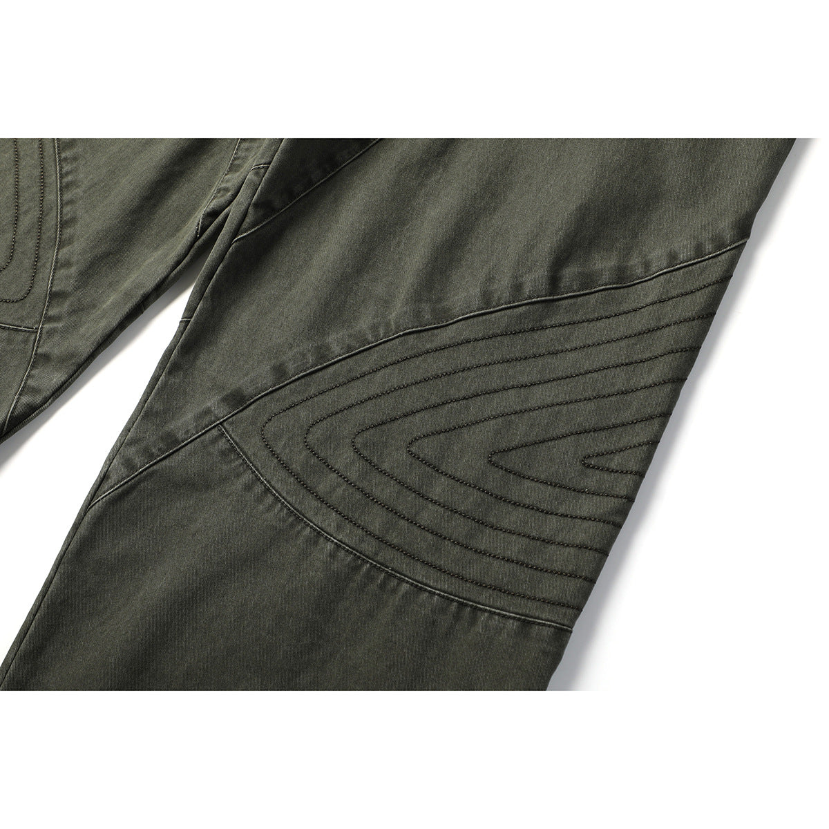 Close-up of olive-gray pants showing curved rows of stitching across a diagonal knee panel.