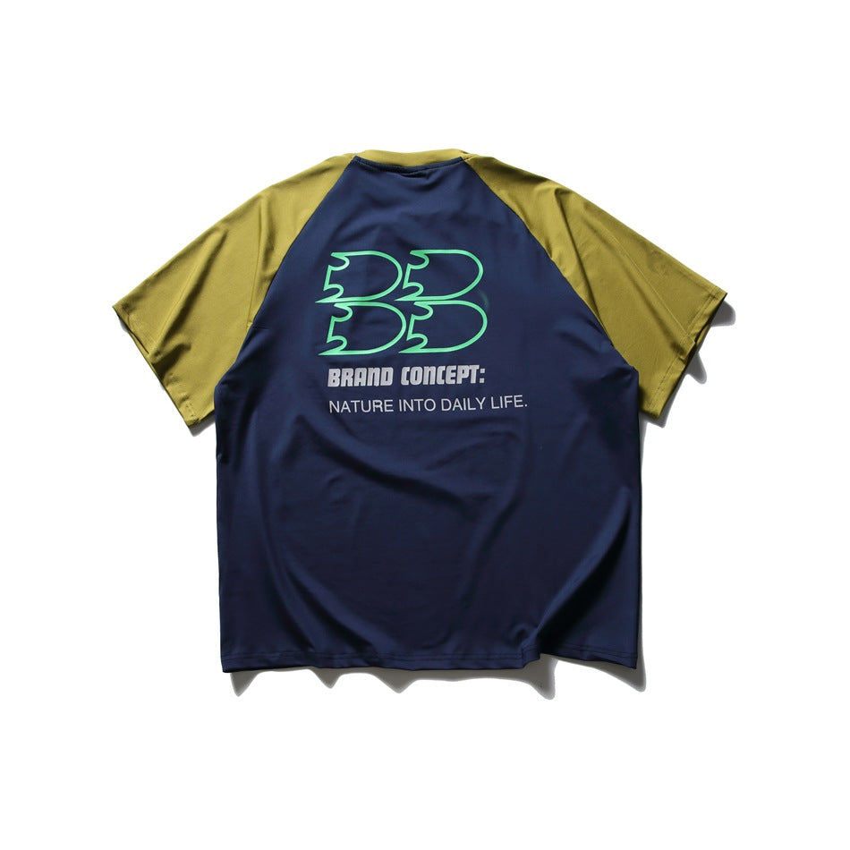 Back view of a navy T-shirt with olive raglan sleeves and large green-and-white printed graphics.