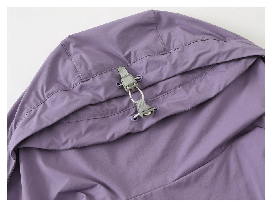 Close-up of the lavender vest hood showing its adjustable cord and toggle.