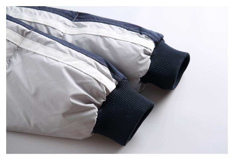 Close-up of the jacket's light gray sleeves, striped trim, and dark ribbed cuffs.