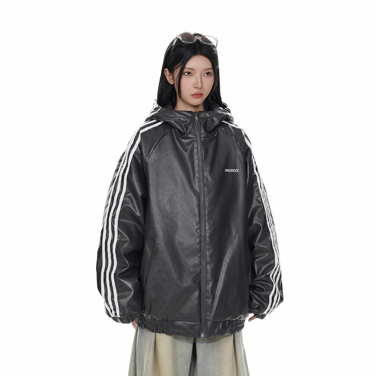 Model wearing a black hooded zip jacket with white sleeve stripes and an elastic hem.